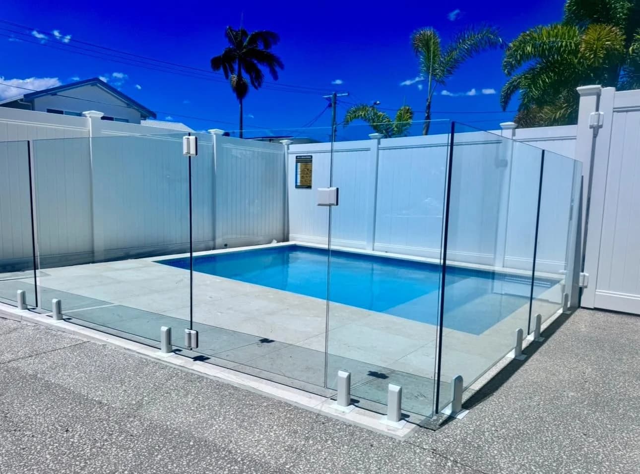 Full privacy PVC panels enclosing pool area with glass fence and gate