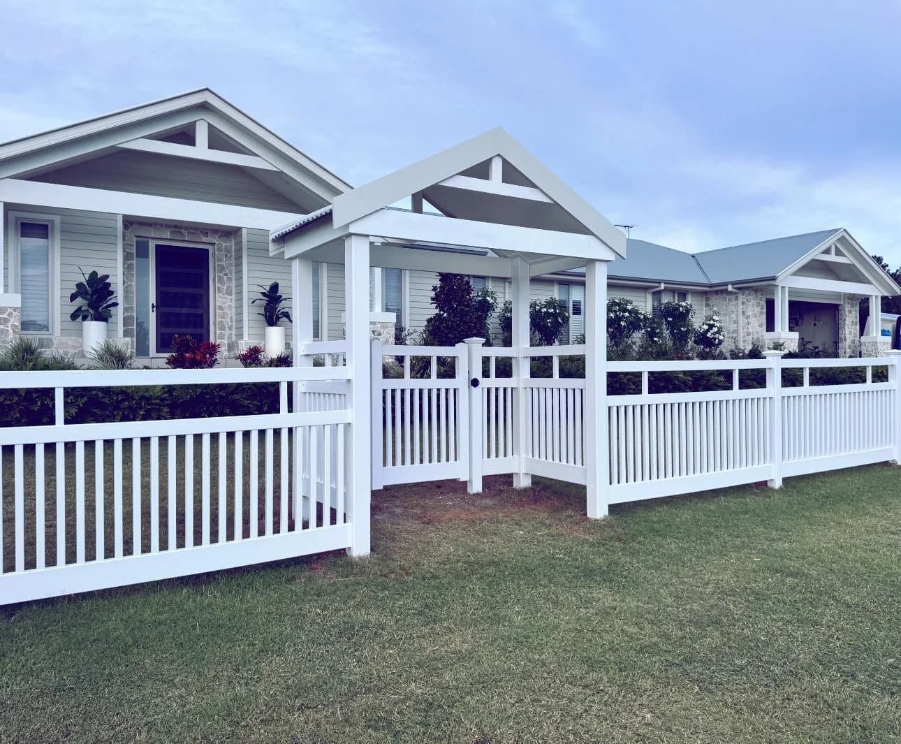 Open picket balustrade PVC front fence with gabled arbour gate
